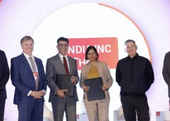 Top executives of Cisco and Rockwell Automation after signing the MoU