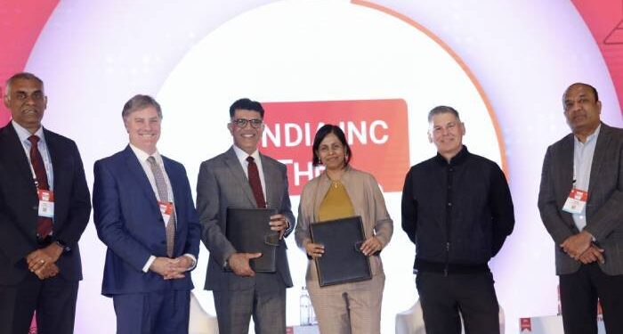 Top executives of Cisco and Rockwell Automation after signing the MoU